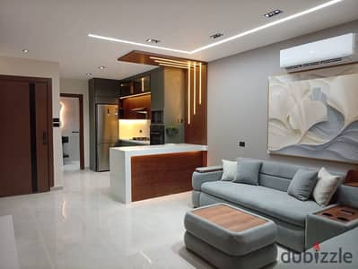 Furnished studio apartment for rent in One Katameya Compound, first occupancy, hotel-style furnishings.