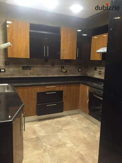 New apartment for rent on 50th Street, Zahraa El Maadi, with kitchen and air conditioning.