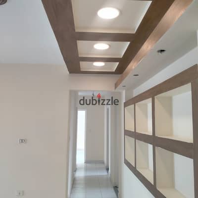 For rent: an apartment in Al-Rehab, 127 sqm, second floor, 3 bedrooms, 2 bathrooms, kitchen, reception with two pieces, with some finishing, close to Gate Mall.