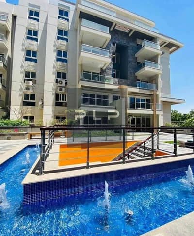 Resale apartment, 155 sqm, prime location next to Palm Hills, in Mountain View iCity New Cairo—priced below market value.
