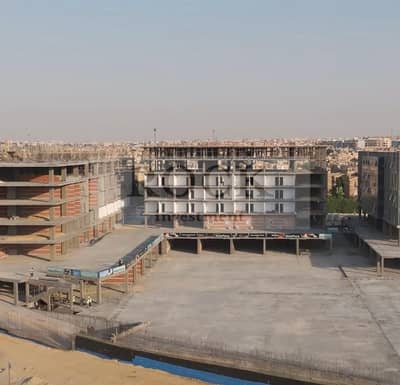 محل بالدور الأرضي على شارع الجامعة الأمريكية - طلب مثبت من كبرى البراندات، من 80 متر