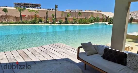 Penthouse with a private roof, directly on the lagoon, fully finished, for sale in a prime location in Ras El Hekma, inside Al Masyaf.