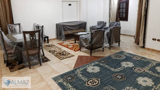 Furnished 200 sqm garden view apartment for rent in the First District Villas, Fifth Settlement, directly overlooking 90th Street.