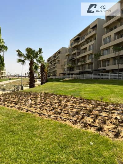 Lowest price for a 2-bedroom apartment with down payment and installments, overlooking the commercial area of ​​Sarai in Palm Hills Capital Gardens