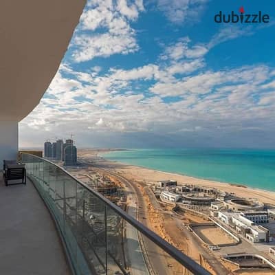 Ready-to-move-in fully finished apartment with air conditioning, direct sea view, North Coast, in Alamein Towers, at a bargain price