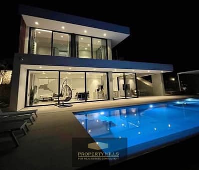 Finished villa with panoramic view, 342 meters, 3 floors with private swimming pool, next to Upville, Mall of Egypt and Wadi Degla Club