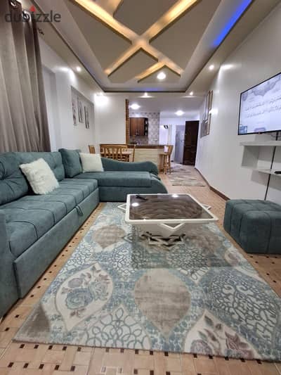 Apartment furnished with modern appliances for sale in Al-Ajmi, Palm Beach, just a few steps from the sea, luxurious finishing.