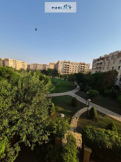 For sale in Madinaty, cash only, a bargain price: a 97 sqm apartment in B7 with a wide garden view, high-end finishes, a clear sea view, on a typical