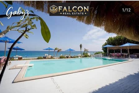 Fully finished chalet (on the sea), ready for immediate occupancy, for sale in Jabal Village in Ain Sokhna, near Porto Sokhna, with a private sandy be