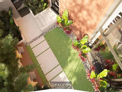 For sale, a duplex with a garden, a fantastic view, and a distinctive location in Taj City, New Cairo