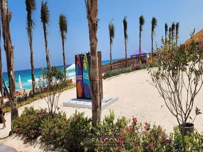 شاليه + روف فيو لاجون كامل التشطيب ف قلب الساحل الشمالي ف قريه كالي كوست CALI COAST