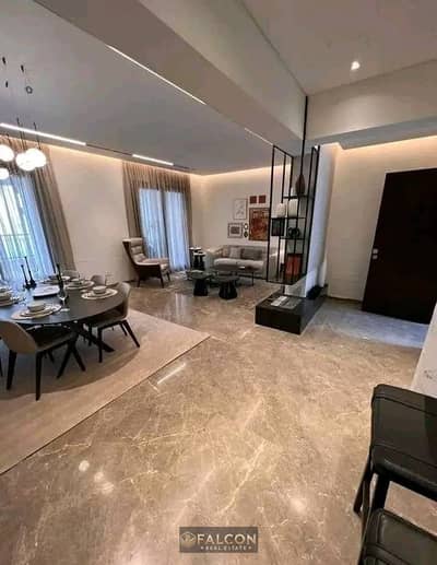 Apartment for sale with a garden (900,000 down payment + 64% cash discount), fully finished (prime location), next to Sodic and New Giza Heliopolis in
