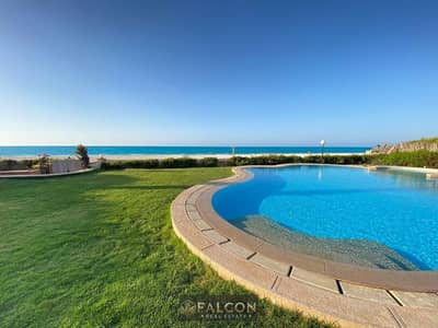 Luxury villa featuring a sandy lagoon and a private beach, situated in the first row by the sea. Ready for immediate handover; fully finished and equi