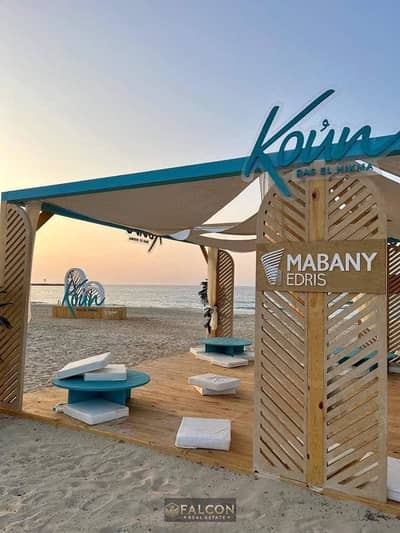 Chalet with pool and lagoon views in Ras El Hekma—48% discount, steps from the sea, ready for immediate handover, and fully finished.