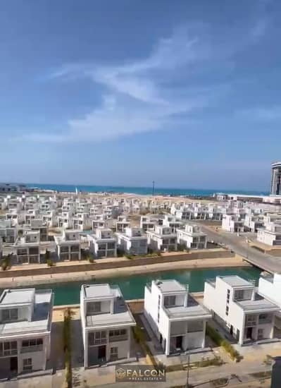 VIP villa in a prime location featuring a private beach and lake access at Al Alamein Lake; ready for immediate handover, fully finished, with a 12-ye
