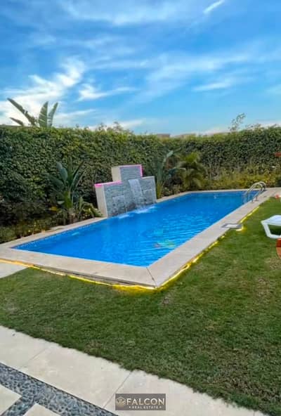 Villa ready for immediate handover at Taj City, featuring a private pool, hotel-style finishing, and an elevator. Located in the front row along Suez