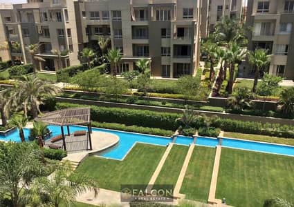 One-bedroom apartment, fully finished, with a direct view of Central Park in Swan Lake Residence, New Cairo, next to AUC and 90th Street.