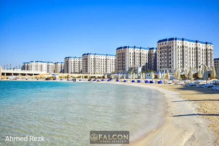 The lowest price for a two-bedroom apartment on the sea, fully finished, ready with the key, waterfront, steps from Al-Aleiman Towers, min from Marina