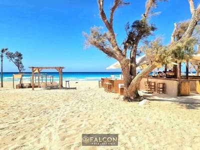 First row Sea View chalet for sale in Marsa Baghoush village, Sidi Heneish, the best sea on the North Coast, in installments over 9 years, distinctive