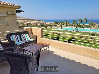 Two-bedroom chalet for sale in Telal Ain Sokhna, featuring a sea view and a prime location near Blue Blue and Porto Sokhna; available with a 10-year