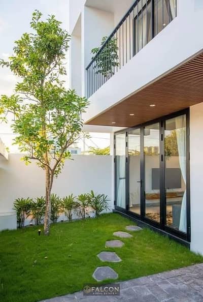 Apartment with a private garden for sale, ready for immediate handover, in El Patio Oro, Fifth Settlement.