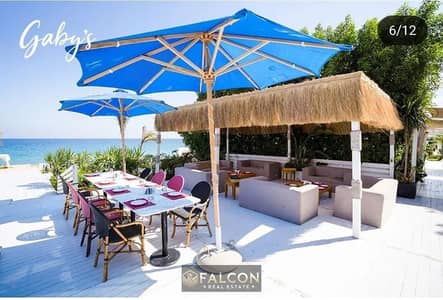 Fully finished chalet (on the sea), ready for immediate occupancy, for sale in Jabal Village in Ain Sokhna, near Porto Sokhna, with a private sandy be