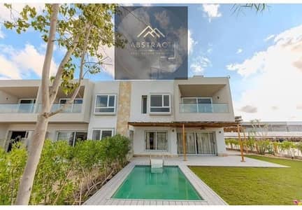 A villa with a direct lagoon view for sale in installments over 10 years fully finished in Ras El Hikma North Coast near Hacienda Silver Sands