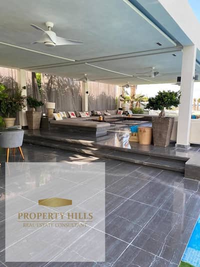 First row villa by the sea, ready for delivery with complete finishing, with a 300-meter garden for sale with a 20% down payment in Direction White
