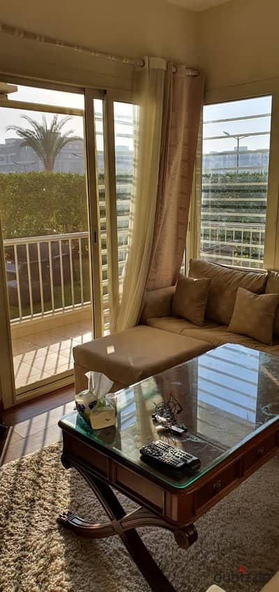 Apartment for rent in The Address Compound, Sheikh Zayed City. 78 sqm interior area with a 120 sqm garden; includes kitchen and air conditioning.