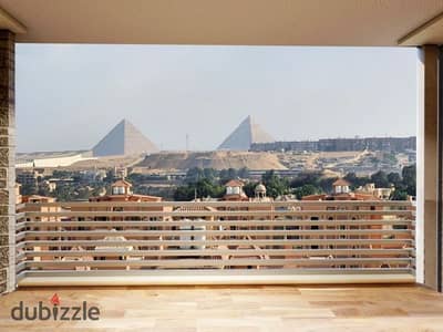 Studio for sale (27 sqm + roof terrace) with a 35% down payment. Located in a prime spot near the Pyramids, facing the Oasis Hotel