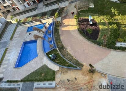 Own a luxurious garden Apartment for sale in New Cairo in the best location in Fifth Settlement on South 90th Street and Hyde Park, The Icon Compound