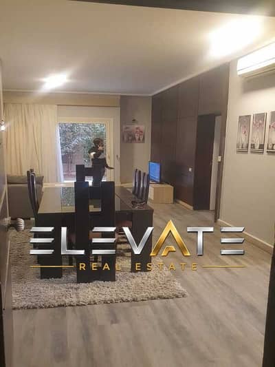 studio 88m with garden  for sale at the village palm hills compound new cairo super lux finished