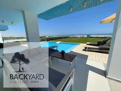 chalet for sale near El Alamein Airport, fully finished and furnished in the North Coast, with a marina view and only 5% down payment.