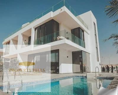 Independent villa with a private pool 525 meters with installment for 12 years, compound villas only, landscape view next to Madinaty