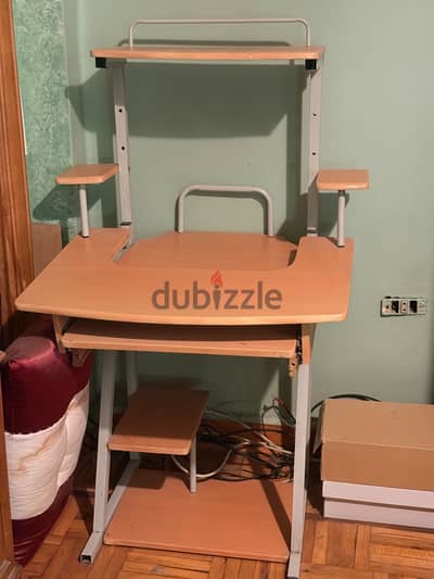 A computer desk metal and wood