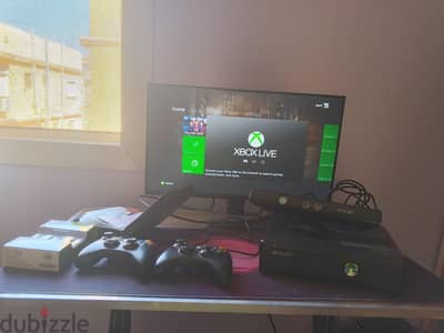 xbox 360 slim 23 Games CD and 2 controllers