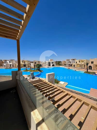 GROUND APARTMENT FOR SALE 1 BEDROOM DIRECT LAGOON BY ORASCOM WITH INSTALLMENTS UP TO 8 YEARS ( NEW GOUNA )