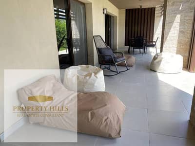 Chalet for sale with a garden, two bedrooms, fully finished with kitchen and air conditioning, at a price lower than the original, with installments up to 8 years in Silver Sands by ORA. Chalet for sale with a garden, two bedrooms, fully finished with kitchen and air conditioning, at a price lower than the original, with installments up to 8 years in Silver Sands by ORA.