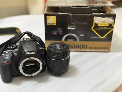 Nikon D3400 جديدة استعمال مرة واحدة + عدستين 18-55 و70-300 VR