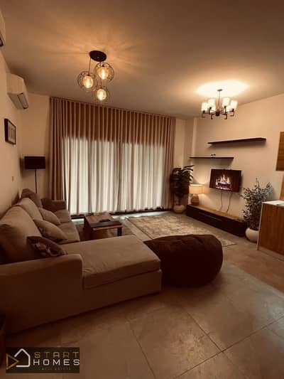130-square-meter, 3-bedroom apartment for rent (furnished, first-time occupancy) in Privado, Madinaty; features an open-plan American-style kitchen