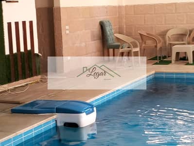 Detached villa for sale in Sheikh Zayed with a prime location and swimming pool at a bargain price.