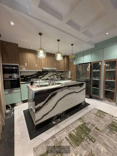 For rent, a ground floor with a garden in ZED West - Sheikh Zayed. A ground floor unit with a spacious garden and a prime location within the project.