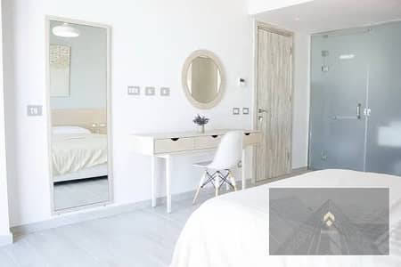 Chalet for sale in Cali Coast (North Coast, Ras El Hekma)—ready for viewing, fully finished, and featuring a 100% lagoon view—with a 35% cash discount