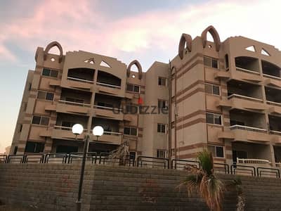 130m² apartment in Al-Mohandessin Oasis Compound; excellent view; priced for a quick sale.