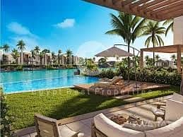 Chalet for sale, first row on the lagoon, at the lowest price in the market in Disney Ras El Hekma. Two bedrooms, 100 square meters, prime location, s