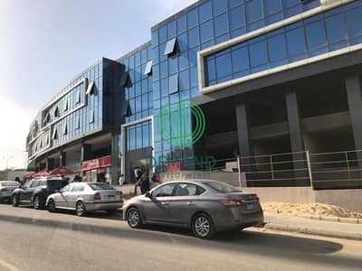 للإيجار محل واجهة 130 متر في مول زايد ديونز في الشيخ زايد  على الشارع الرئيسي مباشرة أمام المدرسة الأمريكية - Zayed Dunes Mall
