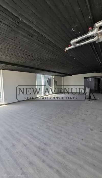 Corner office direct on North 90 Street and plaza view