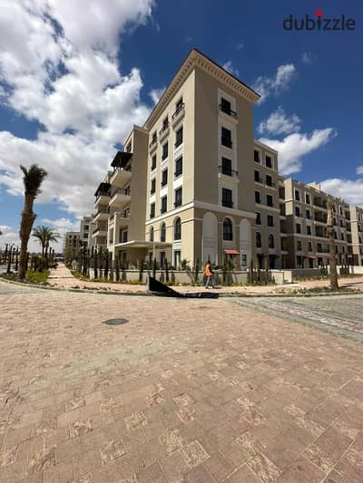 Ready to move apartment for sale in Village West Compound, Sheikh Zayed. Lowest price per meter.