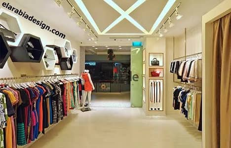 Commercial store of 90 m for rent suitable for any commercial activity, super lux finishing, with all facilities including water, electricity, and bathroom, in Alexandria, Al-Agami, kilo 21, October main street, before the gate, in a very distinguished location.