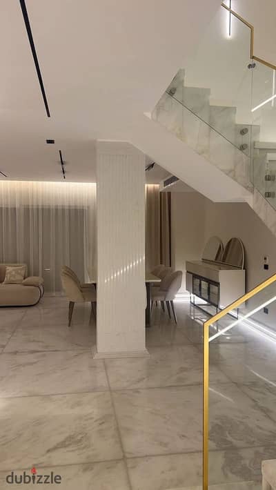 Townhouse for sale in the exclusive, high-end "Zomra" compound. Located in the heart of the Golden Square, Fifth Settlement, directly on 90th Street